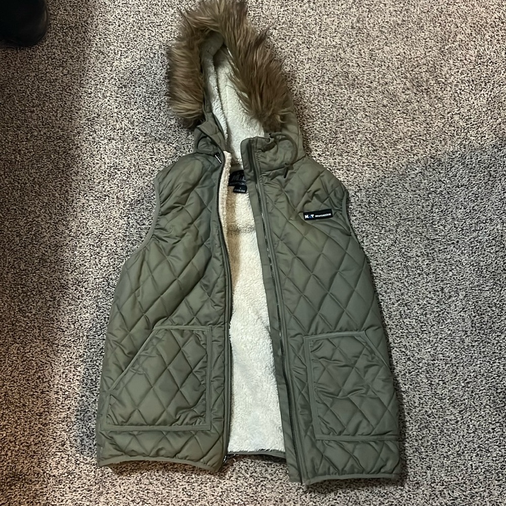 Mountaineering olive faux down vest. Excellent condition!